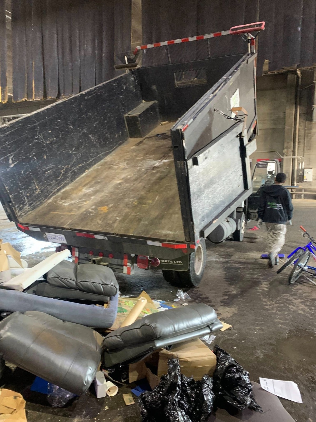 Adios Junk truck unloading in Vancouver